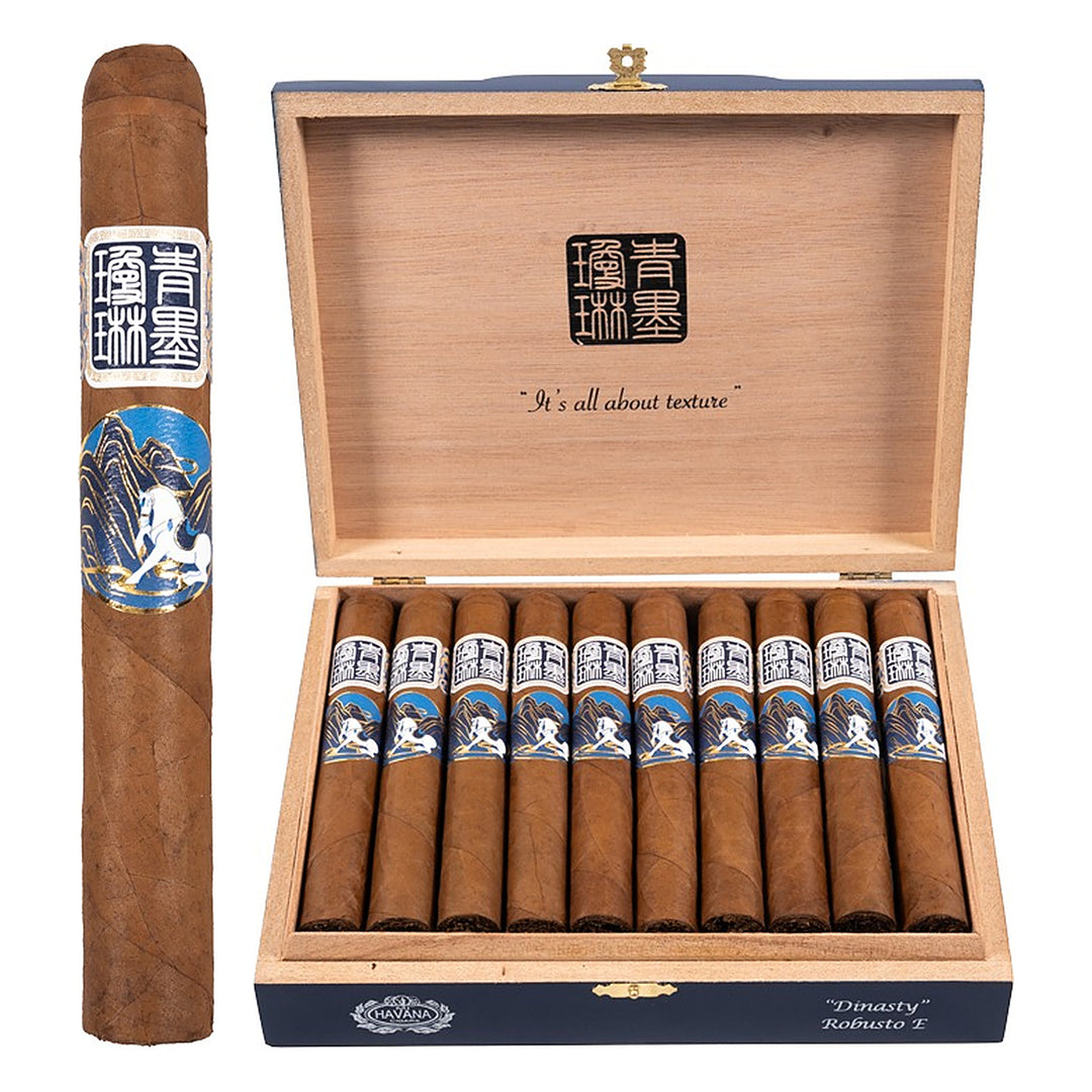 ChiMolly Dynasty Robusto E cigar, 6.0 × 52, with Ecuadorian Corojo wrapper, beside its open box of 20