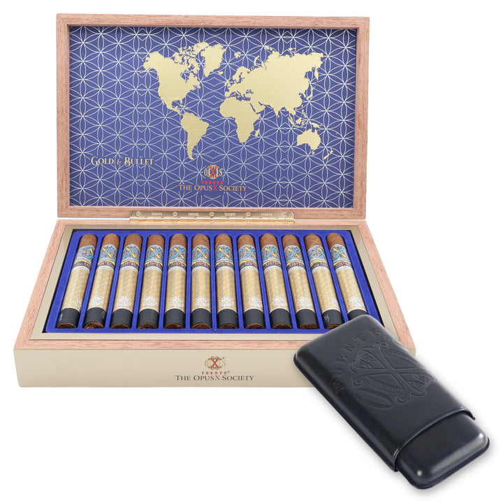 Open box of 12 Fuente Fuente Opus X Society Gold & Bullet cigars with a navy leather Opus X cigar case