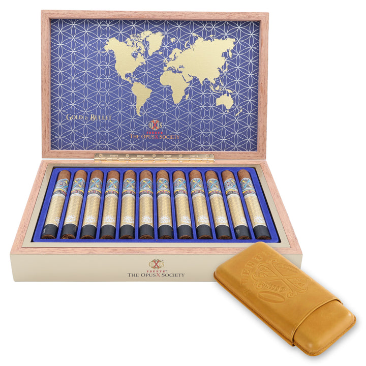 Open box of 12 Fuente Fuente Opus X Society Gold & Bullet cigars with a yellow leather Opus X cigar case