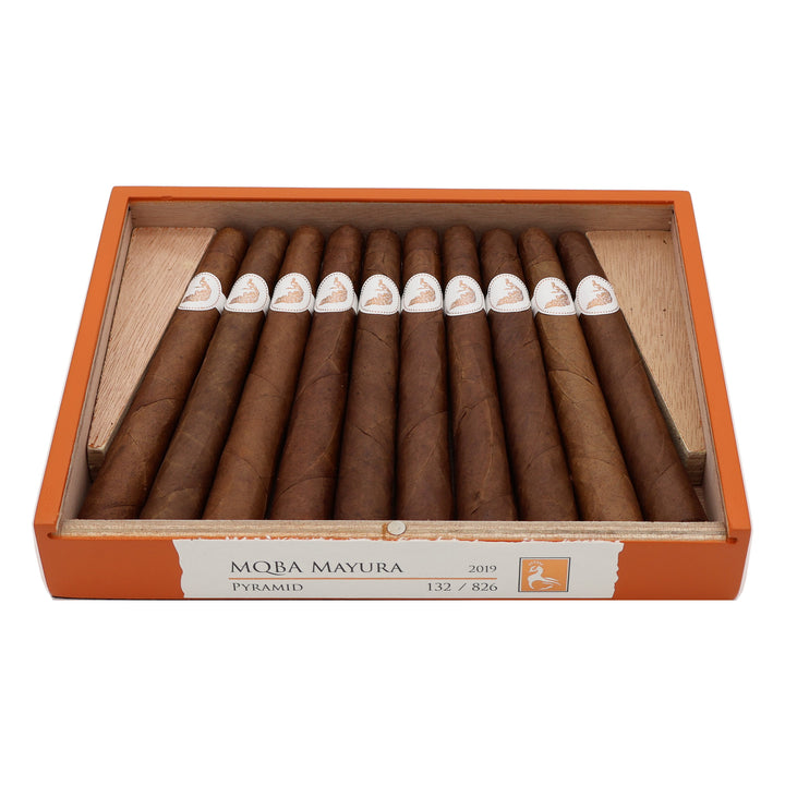 Open box of MBombay MQBA Mayura Pyramid premium cigars showing the full presentation and cigars inside.