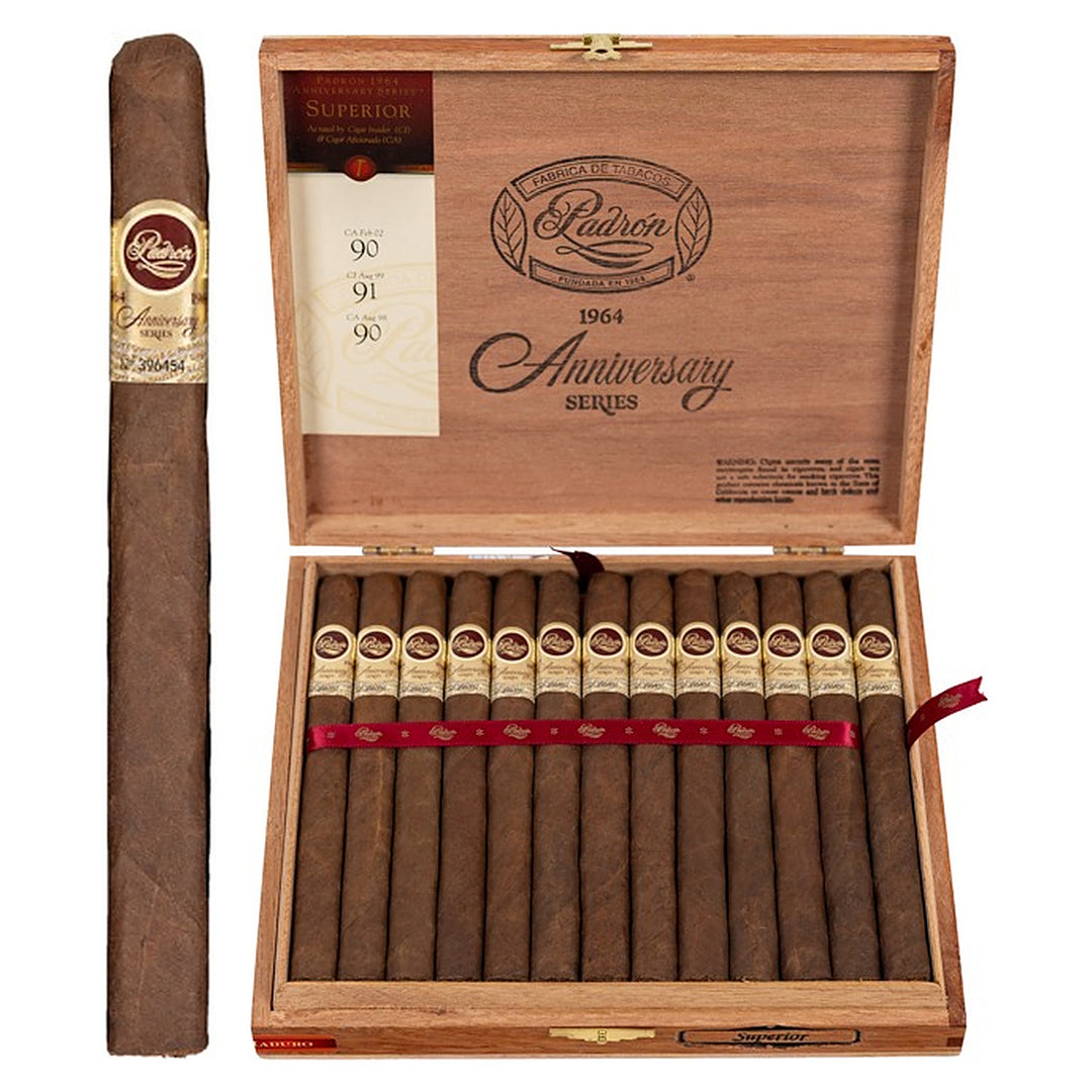 Padron 1964 Anniversary Series Superior Maduro cigar, 6.5 × 42, with Nicaraguan maduro wrapper, beside its open box of 25