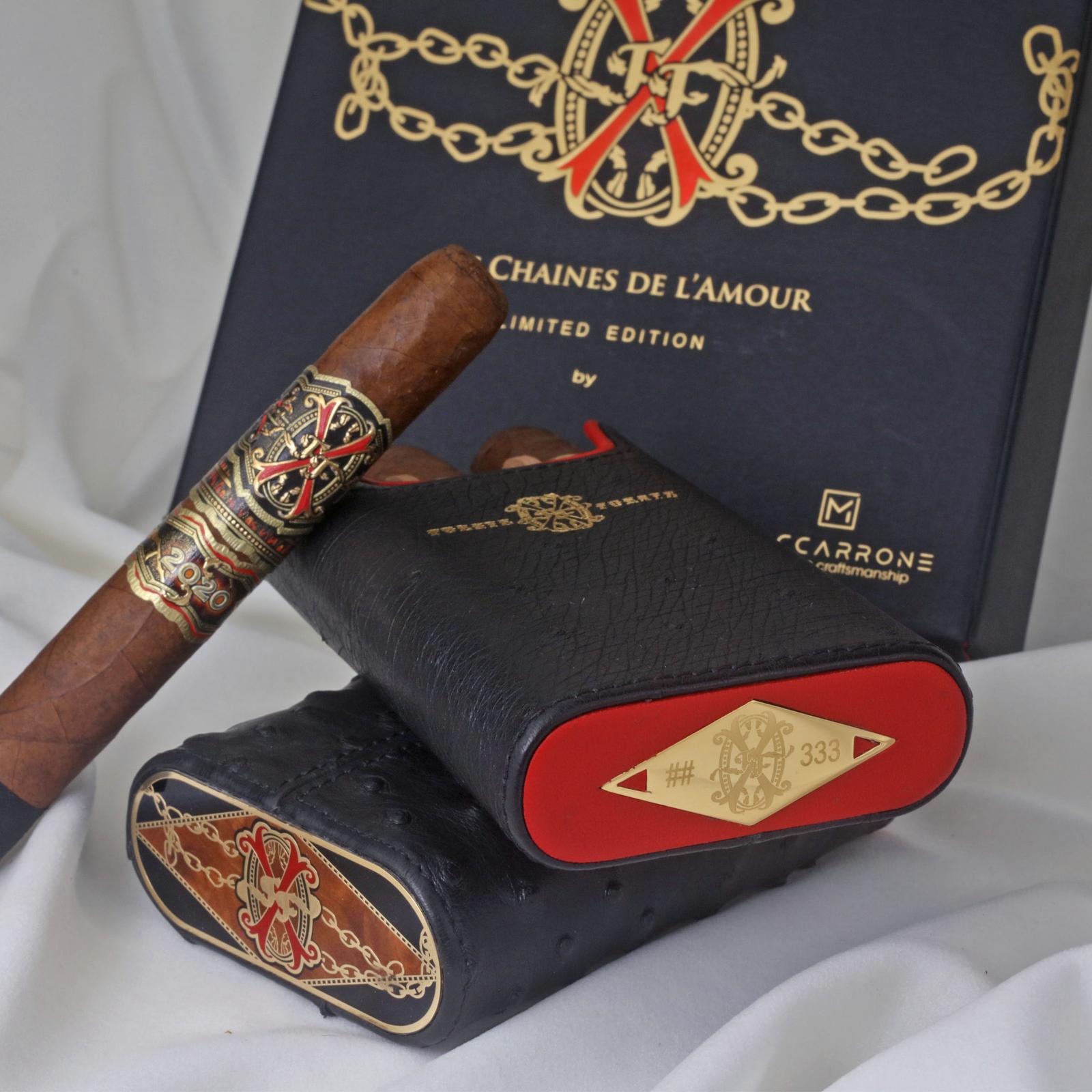 Brizard & Co. x Opus X Les Chaines De L'Amour Maccarrone collaboration cigar case with Opus X cigars, featuring luxurious black ostrich finish.